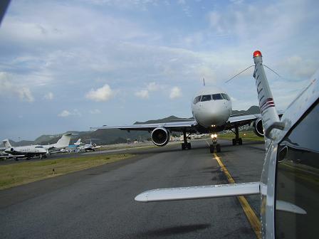 Piper Cherokee single engine 4-seater aircraft taxing in St. Maarten